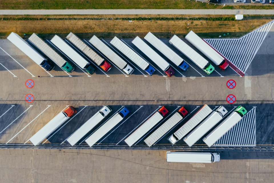 Aerial view of trucks lined up neatly.